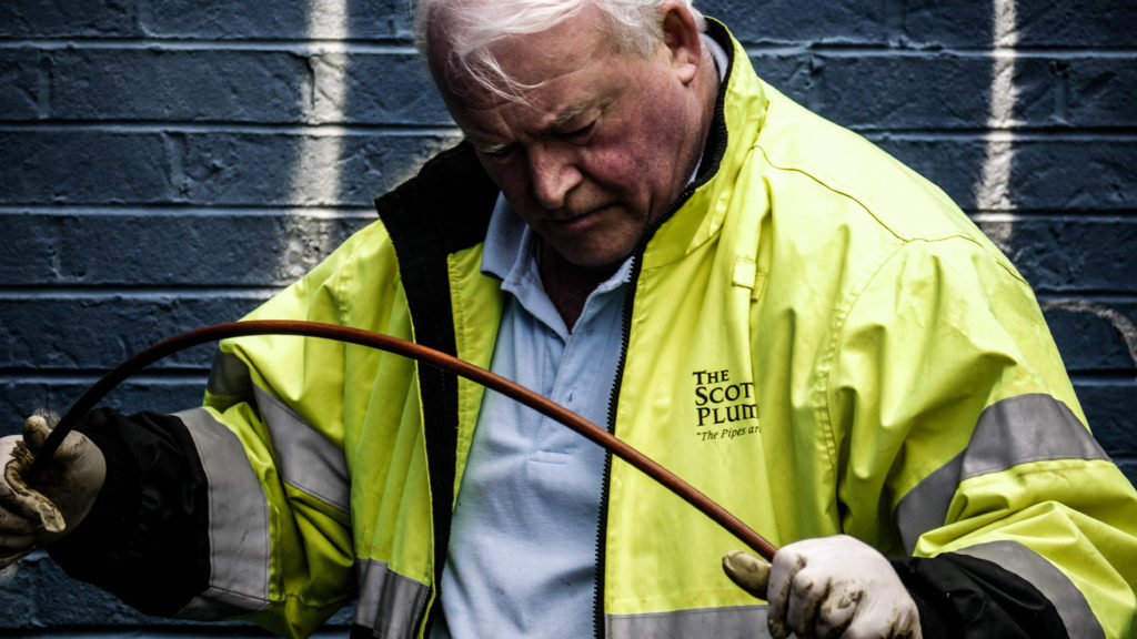 The Scottish Plumber checking a sewer for cracks.