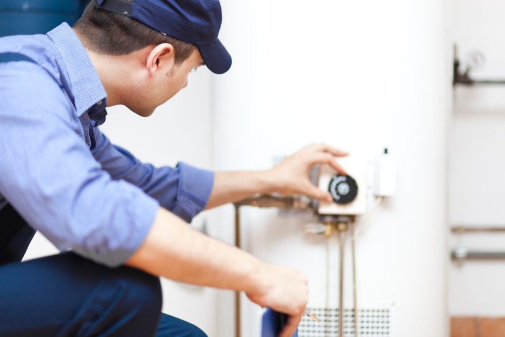 water heater repair Niles water heater replacement The Scottish Plumber working a water heater